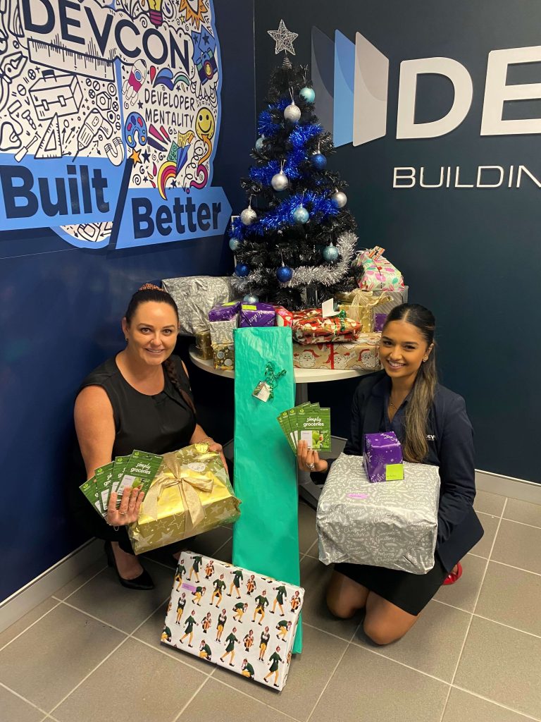 Kristy & Mansi from Devcon with Christmas gifts for those in need